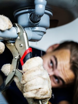 Man fixing kitchen sink